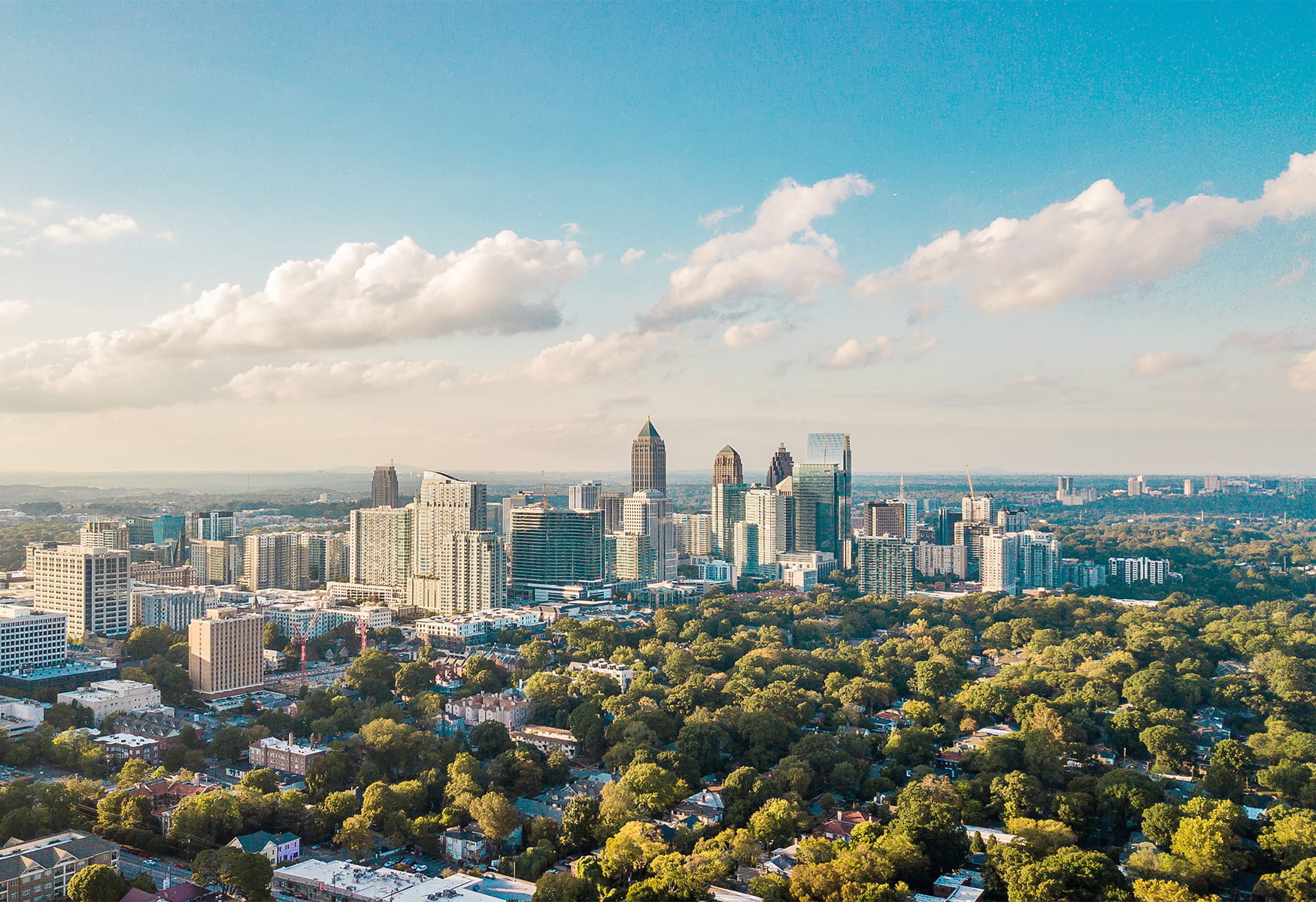 A city skyline with office buildings and commercial real estate. Brown & Brown provides insurance and risk management services for all real estate asset classes, supporting investors from purchase to sale. 